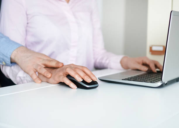 istock Sexual harassment at work. Man touching secretary's hand. 931224862