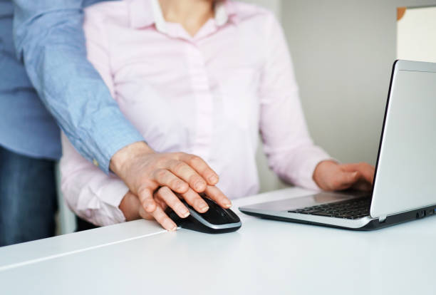 istock Sexual harassment at work. Man touching secretary's hand. 931224864