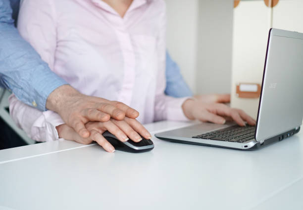 istock Sexual harassment at work. Man touching secretary's hand. 931224882