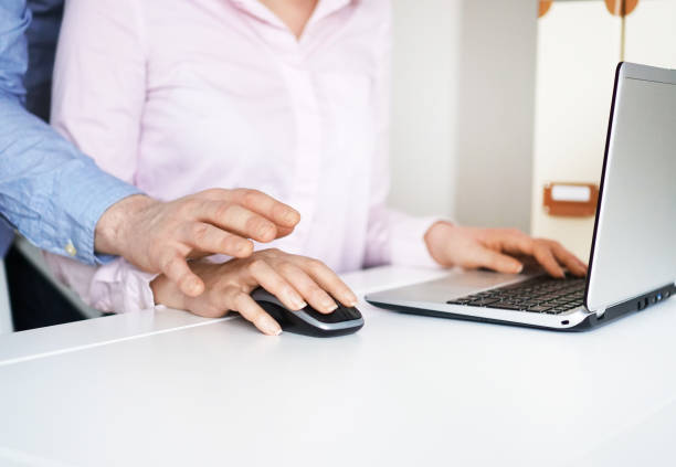 istock Sexual harassment at work. Man touching secretary's hand. 931224884