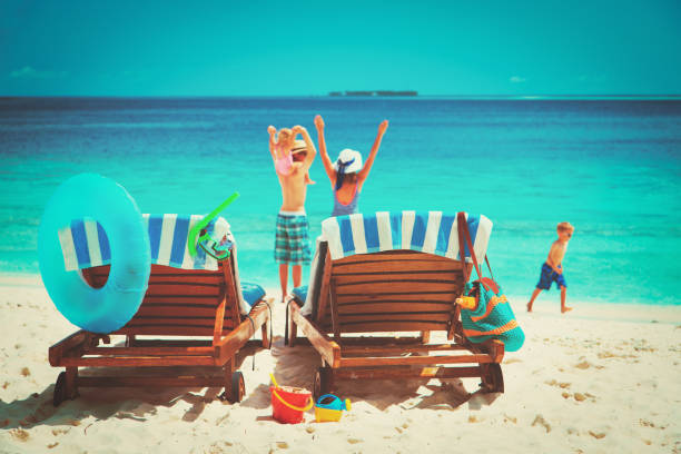 istock happy family with two kids on beach vacation 931226976