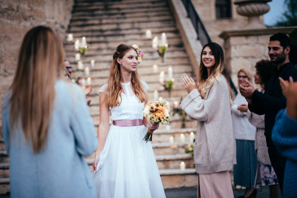 istock Elegant bride walking among guests at wedding ceremony 931228514
