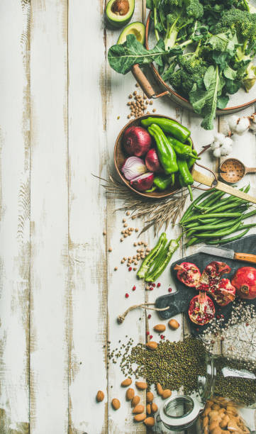 istock Winter vegetarian food cooking ingredients over white background, vertical composition 931230552