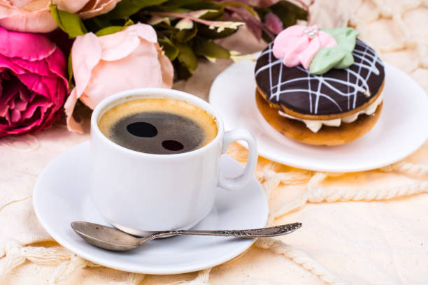 istock Romantic breakfast. Cup of strong hot espresso and cake 931231356