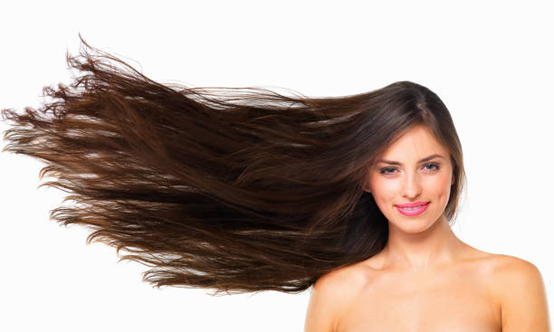 Healthy hair is happy hair Studio portrait of a beautiful young woman posing against a white background long hair stock pictures, royalty-free photos & images