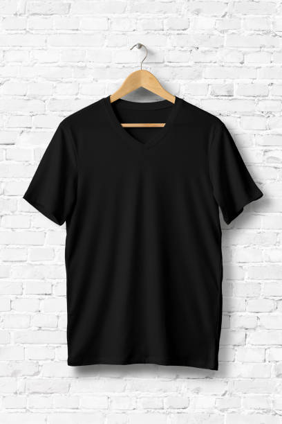 istock Blank V-Neck T-Shirts Mock-up hanging on white brick wall, front side view. 931236852