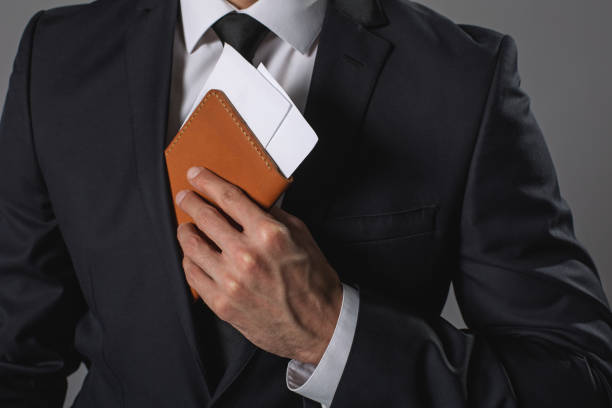 istock Young businessman holding tickets in hand 931239292