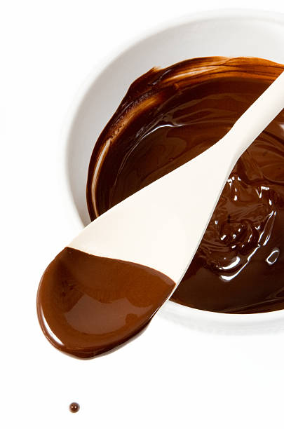 istock Melted dark chocolate dripping from the wooden spoon 93124168