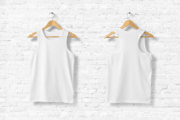 istock White Tank Top Shirt Mock-up hanging on white brick wall, front and rear side view. 931243052