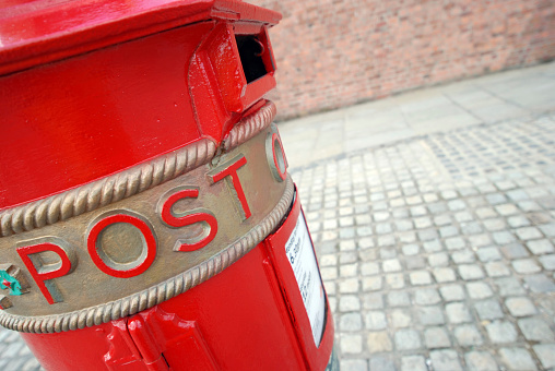 Newcastle-under-Lyme, Staffordshire-united kingdom August,  14, 2022 queen Elizabeth duel post box in pillar box red one side for stamped mail the other for franked office mail copy space