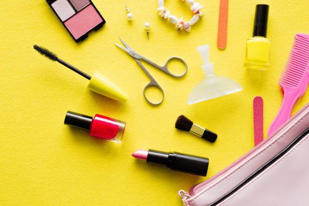 istock Various decorative makeup cosmetics with bag on yellow background. Simple set of nails care. Different, colorful beauty essentials for women. Mockup for special offers as advertising. Flat Lay. 931250996
