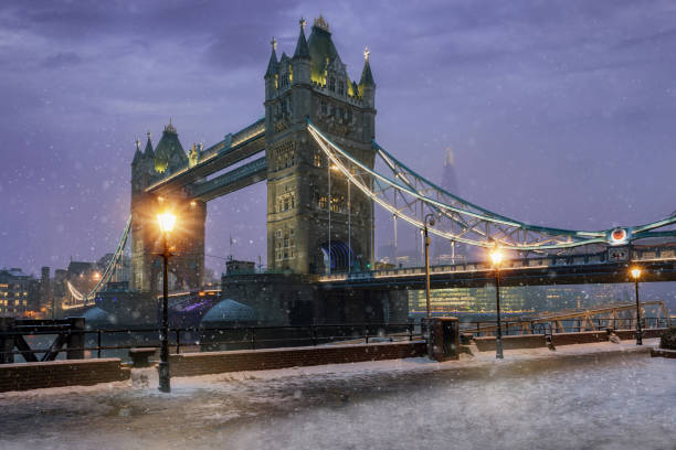 istock The Tower Bridge by night during winter time with falling snow 931251574