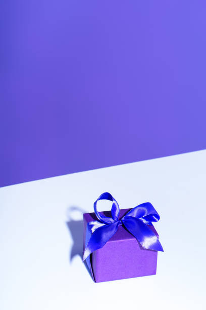 istock purple present with bow, ultra violet trend 931258320