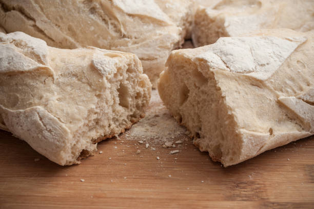 istock traditional bread on wooden cutting board in bamboo texture 931262138