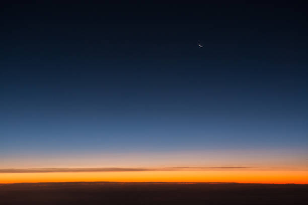 istock Sunset as seen from airplane above clouds 931262768