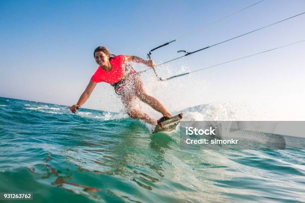 Woman Doing Kitesurfing Stock Photo - Download Image Now - Kiteboarding, Aquatic Sport, Kiteboard