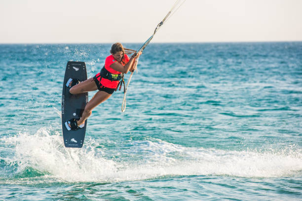 istock Woman doing kitesurfing 931263800