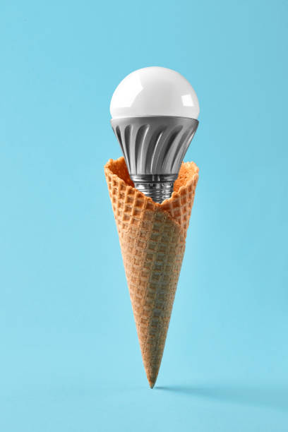 istock Led lamp in ice cream cone, innovation concept 931264050
