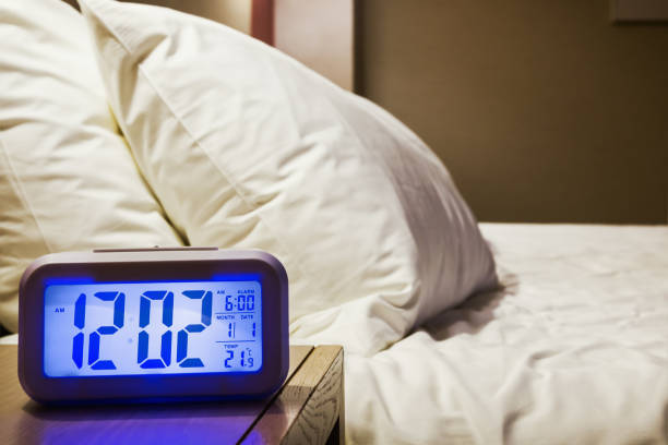 istock electronic alarm clock stands on a bedside table in the room 931269782