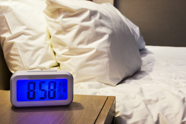 istock electronic alarm clock stands on a bedside table in the room 931269990