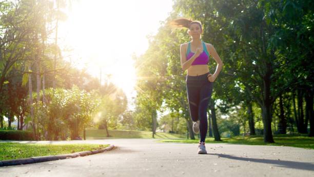 istock Woman Jogging At Public Park 931270288