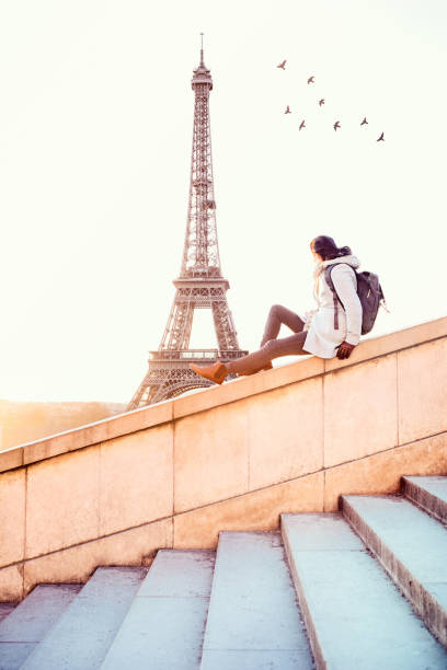 istock Woman looking at the Eiffel Tower in Paris 931274320