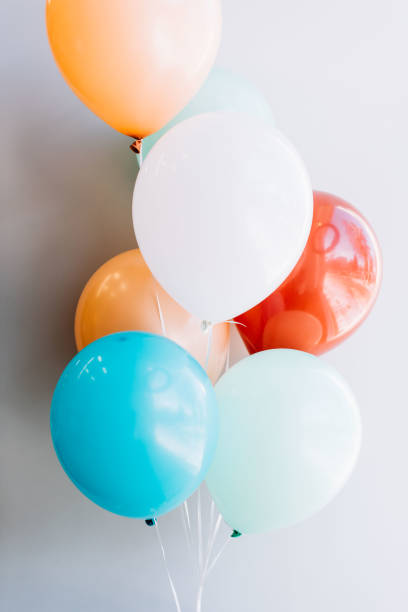 istock festive colourful ballons on the grey wall background 931281756