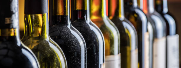 istock Line of wine bottles. Close-up. 931288712