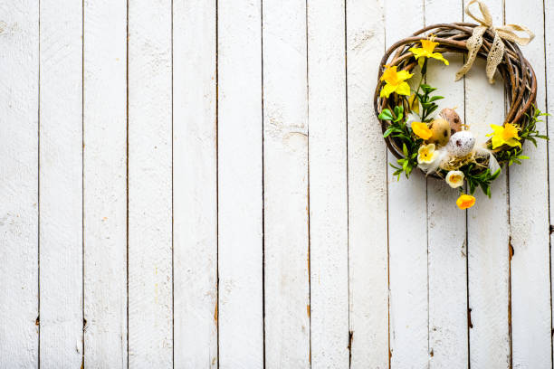 istock Easter background with spring easter eggs and flowers, wreath on door 931289064