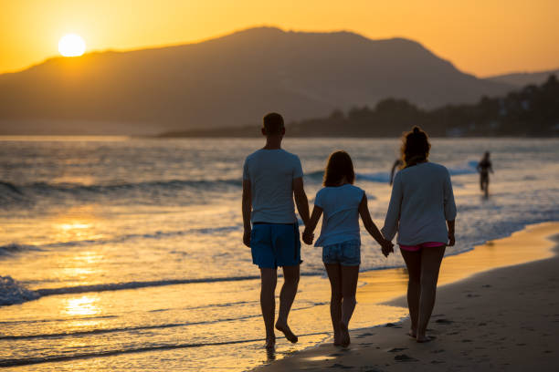 istock Family walking on sea 931289878