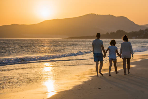 Family walking on sea