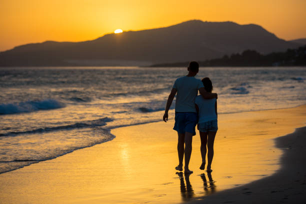 istock Family walking on sea 931289912