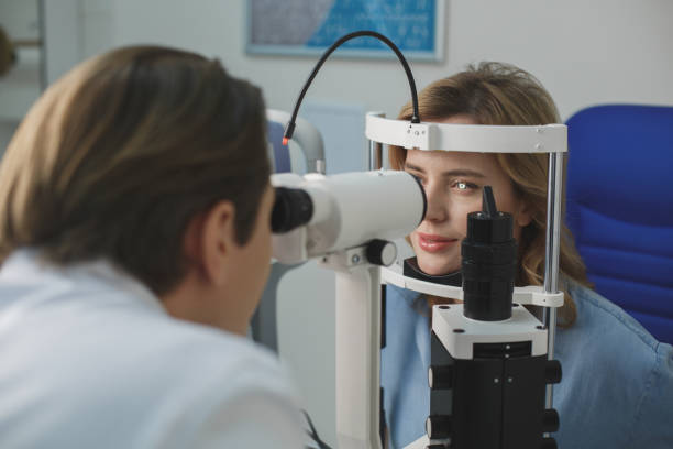 istock Beaming female examining eyesight with equipment 931291048