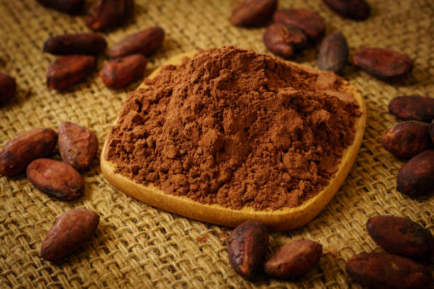 istock Cacao powder and cocoa beans on burlap 931296970
