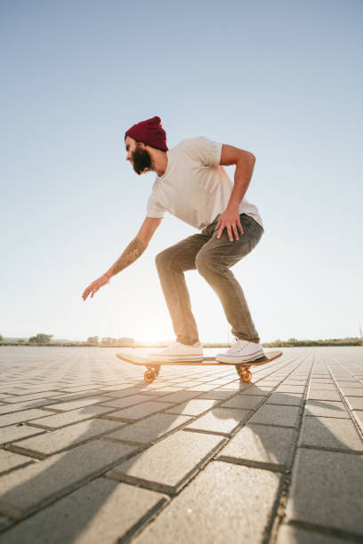 istock Skateboarder hipster skating in the city park 931297036