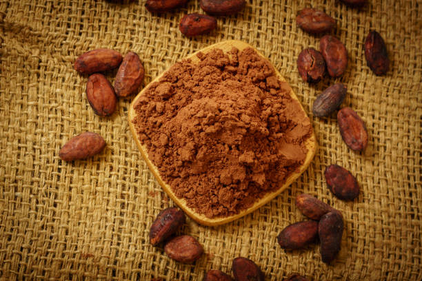 istock Cacao powder and cocoa beans on table 931297562