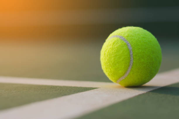 istock Close up tennis ball on the courts background 931308114