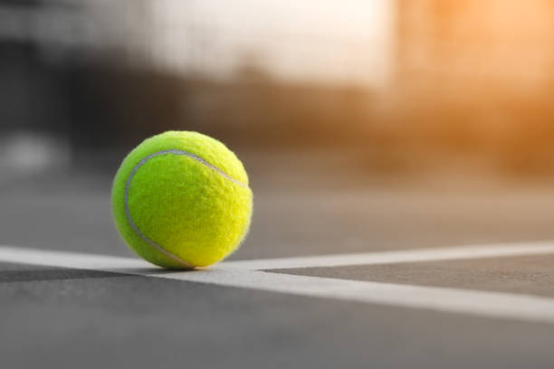 istock Close up tennis ball on the courts background 931308272