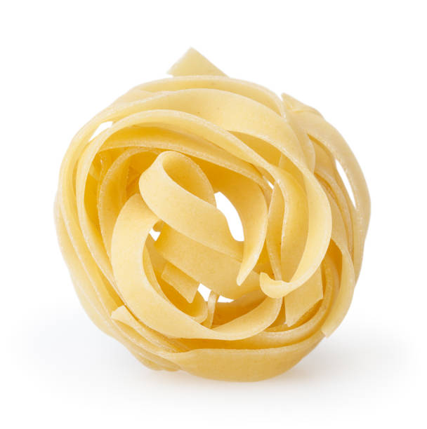 istock Uncooked nest of tagliatelle pasta isolated on white background with clipping path 931317154