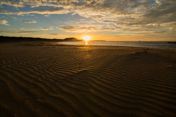 Sunrise over Petreborough beach stock photo