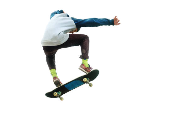 A teenager skateboarder jumps an ollie on an isolated white background. The concept of street sports and urban culture A teenager skateboarder jumps an ollie on an isolated white background. The concept of street sports and urban culture. Ollie stock pictures, royalty-free photos & images