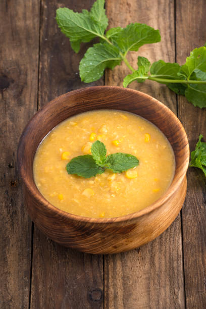istock Corn soup in bowl and sweet corn on plate 931318950