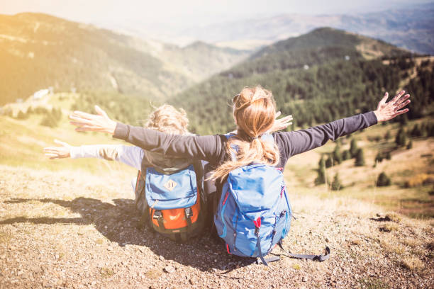 istock Mother and son hiking in mountains 931323874