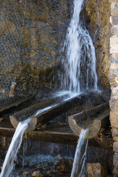 istock Pure mineral drinking water flowing from the natural mountain source 931326584