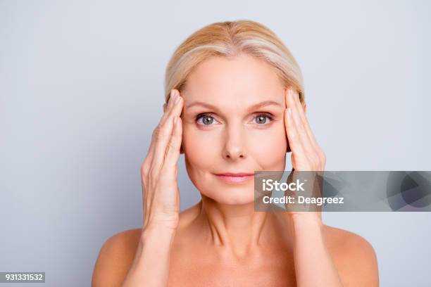Portrait Of Pretty Attractive Charming Naked Nude Woman Touching Temples With Hands Isolated On Grey Background After Peeling Lotion Mask Perfection Wellness Wellbeing Hydration Concept Stock Photo - Download Image Now