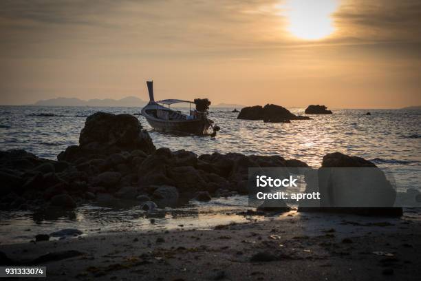 Sunset At Koh Jum Island With Longtail Boat View To Phi Phi Island Stock Photo - Download Image Now