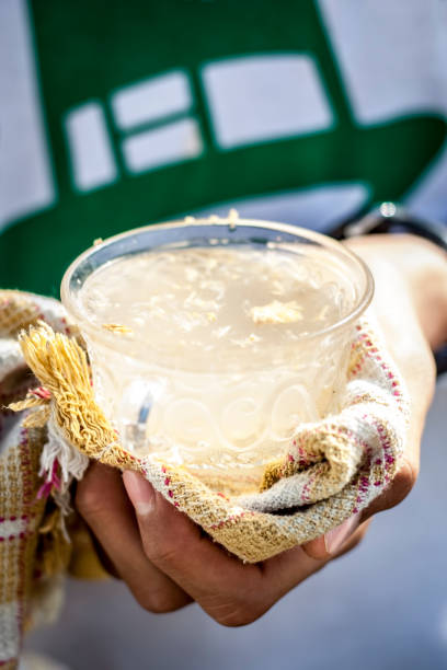 istock A human hand holding white  ginger lemon in his hand with an towel as it is hot. 931338970