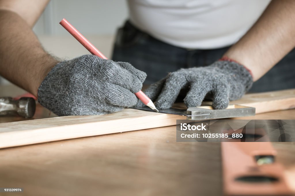 Carpenter Writing Carpenter Measuring And Writing On Wood With Copy Space Background ...