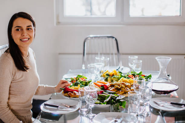 istock Young brunette woman eating meal 931346734