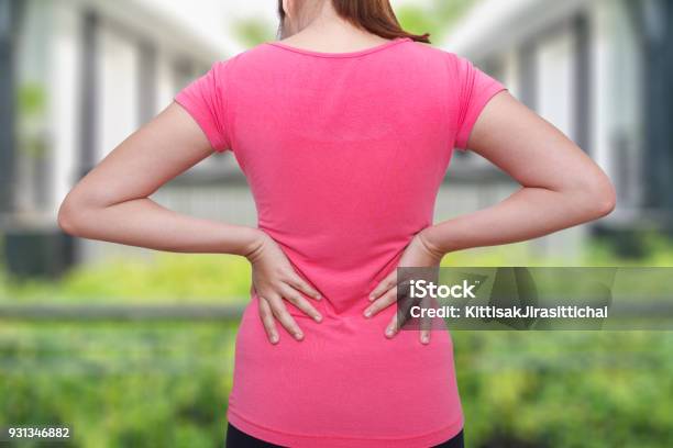 Female Athlete Lower Back Painful Injury Sporty Woman Backache And Injury Stock Photo - Download Image Now